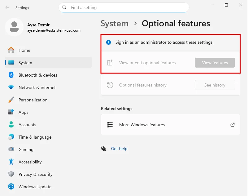 Windows 11 Settings Optional features ekranı ayse.demir oturumunda: Sign in as an administrator to access these settings uyarısı ve soluk View features düğmesi kırmızı çerçevede